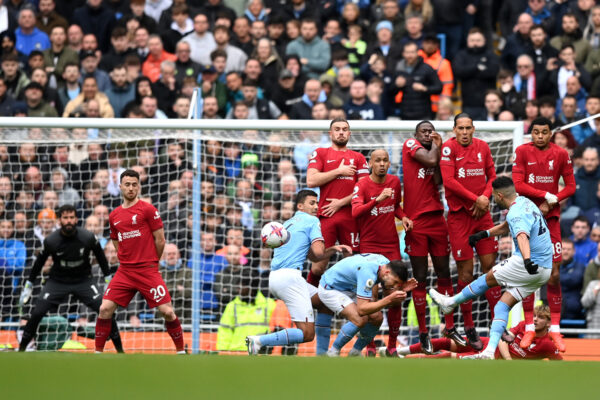 MANCHESTER, ENGLAND - APRIL 01: Riyad Mahrez of Manchester City takes a free kick during the Premier League match between Manchester City and Liverpool FC at Etihad Stadium on April 01, 2023 in Manchester, England. (Photo by Michael Regan/Getty Images)