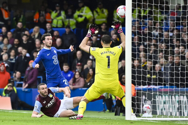 Chelsea's English defender Ben Chilwell (rear C) shoots the ball but hits the post during the English Premier League football match between Chelsea and Aston Villa at Stamford Bridge in London on April 1, 2023. (Photo by JUSTIN TALLIS / AFP) / RESTRICTED TO EDITORIAL USE. No use with unauthorized audio, video, data, fixture lists, club/league logos or 'live' services. Online in-match use limited to 120 images. An additional 40 images may be used in extra time. No video emulation. Social media in-match use limited to 120 images. An additional 40 images may be used in extra time. No use in betting publications, games or single club/league/player publications. / (Photo by JUSTIN TALLIS/AFP via Getty Images)