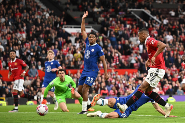 Manchester United's French striker Anthony Martial (R) shoots to score their second goal during the English Premier League football match between Manchester United and Chelsea at Old Trafford in Manchester, north west England, on May 25, 2023. (Photo by Oli SCARFF / AFP) / RESTRICTED TO EDITORIAL USE. No use with unauthorized audio, video, data, fixture lists, club/league logos or 'live' services. Online in-match use limited to 120 images. An additional 40 images may be used in extra time. No video emulation. Social media in-match use limited to 120 images. An additional 40 images may be used in extra time. No use in betting publications, games or single club/league/player publications. / 