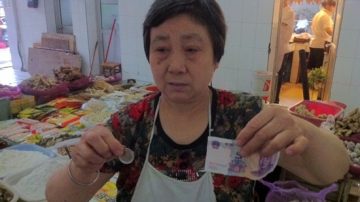 默克爾成都買豆瓣醬 付歐元虧了