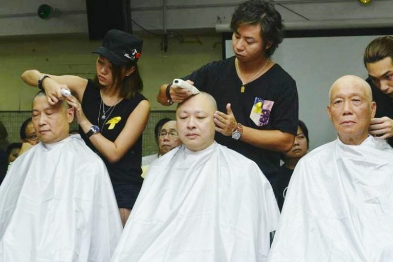 佔中三子剃頭明志遭鬧場 1女義工被踩傷
