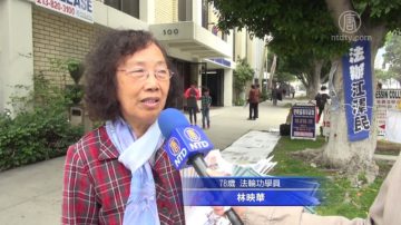 法轮功平和传真相  黑衣男暴怒成反差