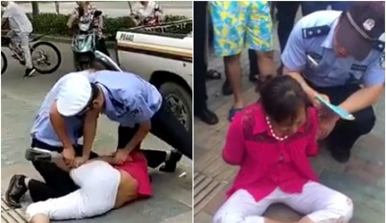 上海警察摔倒抱娃妇女 网民：与民为敌（视频）