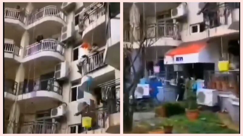 中国疫区“封楼” 居民无奈用水桶吊食物(视频)