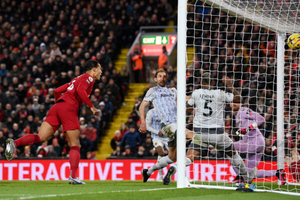 LIVERPOOL, ENGLAND - MARCH 01: Virgil van Dijk of Liverpool scores the team's first goal past Jose Sa (obscured) of Wolverhampton Wanderers during the Premier League match between Liverpool FC and Wolverhampton Wanderers at Anfield on March 01, 2023 in Liverpool, England. 