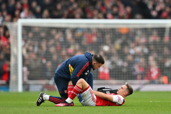 Arsenal's Belgian midfielder Leandro Trossard receives medical attention during the English Premier League football match between Arsenal and Bournemouth at the Emirates Stadium in London on March 4, 2023. (Photo by Glyn KIRK / AFP) / RESTRICTED TO EDITORIAL USE. No use with unauthorized audio, video, data, fixture lists, club/league logos or 'live' services. Online in-match use limited to 120 images. An additional 40 images may be used in extra time. No video emulation. Social media in-match use limited to 120 images. An additional 40 images may be used in extra time. No use in betting publications, games or single club/league/player publications. / (Photo by GLYN KIRK/AFP via Getty Images)