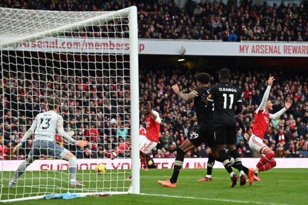 Arsenal's Ghanaian midfielder Thomas Partey (C) scores his team first goal during the English Premier League football match between Arsenal and Bournemouth at the Emirates Stadium in London on March 4, 2023. (Photo by Glyn KIRK / AFP) / RESTRICTED TO EDITORIAL USE. No use with unauthorized audio, video, data, fixture lists, club/league logos or 'live' services. Online in-match use limited to 120 images. An additional 40 images may be used in extra time. No video emulation. Social media in-match use limited to 120 images. An additional 40 images may be used in extra time. No use in betting publications, games or single club/league/player publications. / (Photo by GLYN KIRK/AFP via Getty Images)