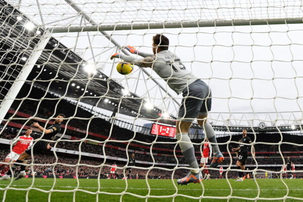 Arsenal's English defender Ben White (L) scores his team second goal past Bournemouth's Brazilian goalkeeper Neto during the English Premier League football match between Arsenal and Bournemouth at the Emirates Stadium in London on March 4, 2023. (Photo by Glyn KIRK / AFP) / RESTRICTED TO EDITORIAL USE. No use with unauthorized audio, video, data, fixture lists, club/league logos or 'live' services. Online in-match use limited to 120 images. An additional 40 images may be used in extra time. No video emulation. Social media in-match use limited to 120 images. An additional 40 images may be used in extra time. No use in betting publications, games or single club/league/player publications. / (Photo by GLYN KIRK/AFP via Getty Images)
