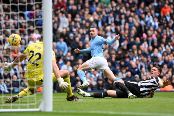 MANCHESTER, ENGLAND - MARCH 04: Phil Foden of Manchester City scores the team's first goal during the Premier League match between Manchester City and Newcastle United at Etihad Stadium on March 04, 2023 in Manchester, England. (Photo by Laurence Griffiths/Getty Images)