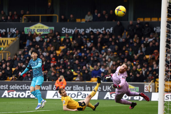 Tottenham Hotspur's South Korean striker Son Heung-Min (L) shoots the ball but misses to score during the English Premier League football match between Wolverhampton Wanderers and Tottenham Hotspur at the Molineux stadium in Wolverhampton, central England on March 4, 2023. (Photo by DARREN STAPLES / AFP) / RESTRICTED TO EDITORIAL USE. No use with unauthorized audio, video, data, fixture lists, club/league logos or 'live' services. Online in-match use limited to 120 images. An additional 40 images may be used in extra time. No video emulation. Social media in-match use limited to 120 images. An additional 40 images may be used in extra time. No use in betting publications, games or single club/league/player publications. / (Photo by DARREN STAPLES/AFP via Getty Images)