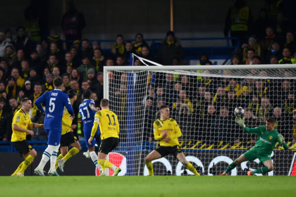 LONDON, ENGLAND - MARCH 07: Raheem Sterling of Chelsea scores the team's first goal as Alexander Meyer of Borussia Dortmund attempts to make a save during the UEFA Champions League round of 16 leg two match between Chelsea FC and Borussia Dortmund at Stamford Bridge on March 07, 2023 in London, England. (Photo by Justin Setterfield/Getty Images)
