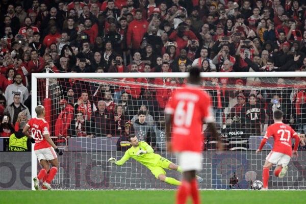 TOPSHOT - Benfica's Portuguese midfielder Joao Mario (L) scores his team's fourth goal from the penalty spot during the UEFA Champions League round of 16 second leg football match between SL Benfica and Club Brugge at the Luz stadium in Lisbon on March 7, 2023. (Photo by PATRICIA DE MELO MOREIRA / AFP) (Photo by PATRICIA DE MELO MOREIRA/AFP via Getty Images)