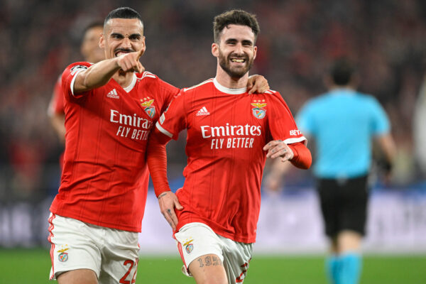Benfica's Portuguese midfielder Rafa Silva (R) celebrates scoring the opening goal with Benfica's Portuguese defender Chiquinho during the UEFA Champions League round of 16 second leg football match between SL Benfica and Club Brugge at the Luz stadium in Lisbon on March 7, 2023. (Photo by PATRICIA DE MELO MOREIRA / AFP) (Photo by PATRICIA DE MELO MOREIRA/AFP via Getty Images)