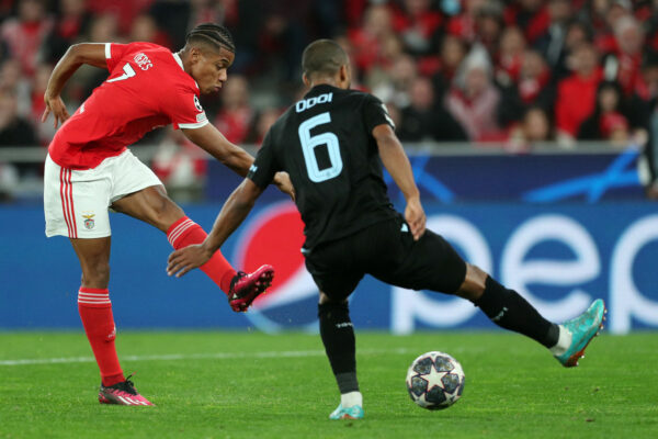 TOPSHOT - Benfica's Brazilian midfielder David Neres (L) scores his team's fifth goal during the UEFA Champions League round of 16 second leg football match between SL Benfica and Club Brugge at the Luz stadium in Lisbon on March 7, 2023. (Photo by CARLOS COSTA / AFP) (Photo by CARLOS COSTA/AFP via Getty Images)