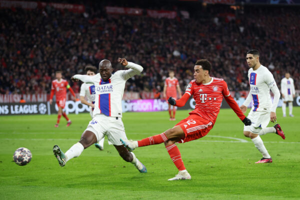MUNICH, GERMANY - MARCH 08: Jamal Musiala of FC Bayern Munich shoots while under pressure from Danilo Pereira of Paris Saint-Germain during the UEFA Champions League round of 16 leg two match between FC Bayern M眉nchen and Paris Saint-Germain at Allianz Arena on March 08, 2023 in Munich, Germany. (Photo by Alex Grimm/Getty Images)