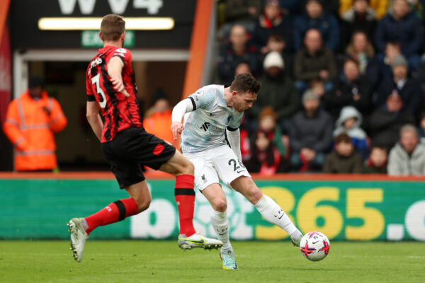 BOURNEMOUTH, ENGLAND - MARCH 11: Andrew Robertson of Liverpool shoots while under pressure from Jack Stephens of AFC Bournemouth during the Premier League match between AFC Bournemouth and Liverpool FC at Vitality Stadium on March 11, 2023 in Bournemouth, England. (Photo by Luke Walker/Getty Images)