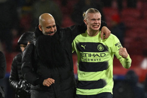 Manchester City's Spanish manager Pep Guardiola (L) celebrates with Manchester City's Norwegian striker Erling Haaland (R) after the English Premier League football match between Crystal Palace and Manchester City at Selhurst Park in south London on March 11, 2023. - Manchester City won the game 1-0. (Photo by Ben Stansall / AFP) / RESTRICTED TO EDITORIAL USE. No use with unauthorized audio, video, data, fixture lists, club/league logos or 'live' services. Online in-match use limited to 120 images. An additional 40 images may be used in extra time. No video emulation. Social media in-match use limited to 120 images. An additional 40 images may be used in extra time. No use in betting publications, games or single club/league/player publications. / (Photo by BEN STANSALL/AFP via Getty Images)