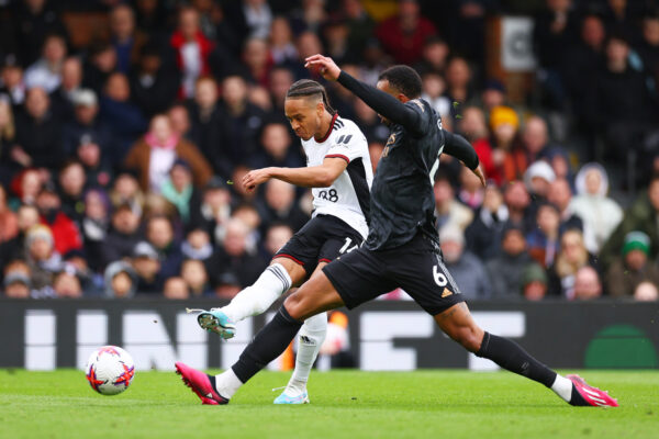 LONDON, ENGLAND - MARCH 12: Bobby Reid of Fulham shoots whilst under pressure from Douglas Luiz of Aston Villa during the Premier League match between Fulham FC and Arsenal FC at Craven Cottage on March 12, 2023 in London, England. (Photo by Clive Rose/Getty Images)