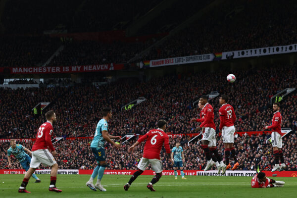 Southampton's English midfielder James Ward-Prowse (L) hits the woodwork with this freekick during the English Premier League football match between Manchester United and Southampton at Old Trafford in Manchester, north-west England, on March 12, 2023. (Photo by DARREN STAPLES / AFP) / RESTRICTED TO EDITORIAL USE. No use with unauthorized audio, video, data, fixture lists, club/league logos or 'live' services. Online in-match use limited to 120 images. An additional 40 images may be used in extra time. No video emulation. Social media in-match use limited to 120 images. An additional 40 images may be used in extra time. No use in betting publications, games or single club/league/player publications. / (Photo by DARREN STAPLES/AFP via Getty Images)