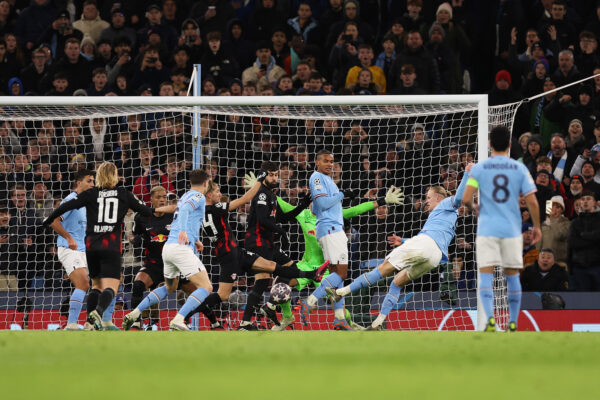 MANCHESTER, ENGLAND - MARCH 14: Erling Haaland of Manchester City scores the team's fifth goal past Janis Blaswich of RB Leipzig during the UEFA Champions League round of 16 leg two match between Manchester City and RB Leipzig at Etihad Stadium on March 14, 2023 in Manchester, England. (Photo by Catherine Ivill/Getty Images)