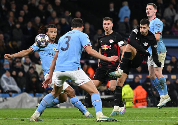 Leipzig's Portugese striker Andre Silva (3R) shoots but fails to score during the UEFA Champions League round of 16 second-leg football match between Manchester City and RB Leipzig at the Etihad Stadium in Manchester, north west England, on March 14, 2023. (Photo by Paul ELLIS / AFP) (Photo by PAUL ELLIS/AFP via Getty Images)