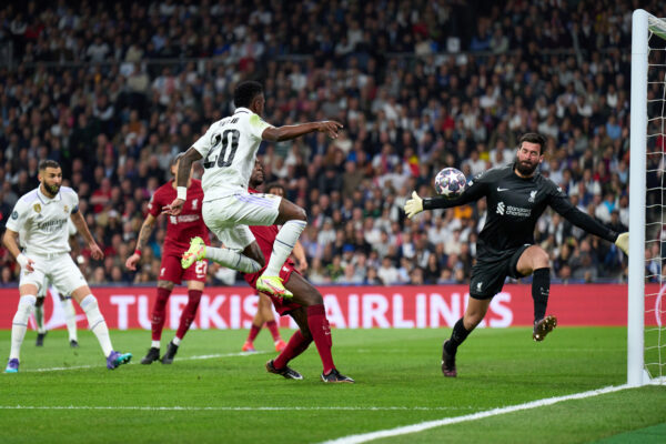 MADRID, SPAIN - MARCH 15: Alisson Becker of Liverpool FC saves shot from Vinicius Junior of Real Madrid during the UEFA Champions League round of 16 leg two match between Real Madrid and Liverpool FC at Estadio Santiago Bernabeu on March 15, 2023 in Madrid, Spain. (Photo by Angel Martinez/Getty Images)