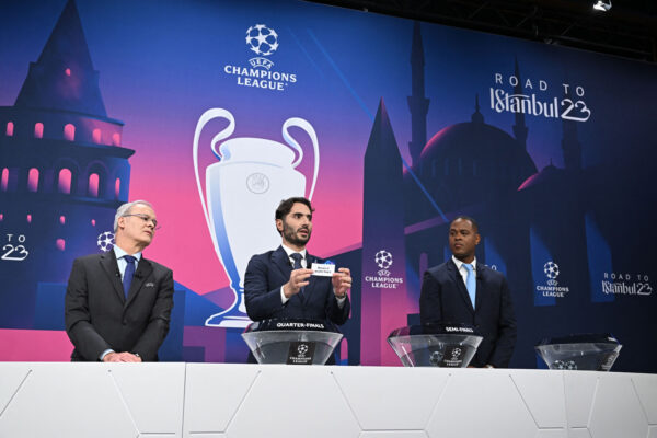 )UEFA Champions League final ambassador Turkish former footballer Hamit Altintop (C) picks a draw for the semi-final of the 2022-2023 UEFA Champions League football tournament, as UEFA Deputy General Secretary Giorgio Marchetti (L) and UEFA Champions League final ambassador Dutch former footballer Patrick Kluivert (R) look on in Nyon, on March 17, 2023. (Photo by Fabrice COFFRINI / AFP) (Photo by FABRICE COFFRINI/AFP via Getty Images)