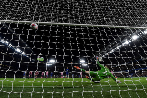 Chelsea's German midfielder Kai Havertz shoots a penalty and scores his team second goal past Everton's English goalkeeper Jordan Pickford during the English Premier League football match between Chelsea and Everton at Stamford Bridge in London on March 18, 2023. (Photo by Glyn KIRK / AFP) / RESTRICTED TO EDITORIAL USE. No use with unauthorized audio, video, data, fixture lists, club/league logos or 'live' services. Online in-match use limited to 120 images. An additional 40 images may be used in extra time. No video emulation. Social media in-match use limited to 120 images. An additional 40 images may be used in extra time. No use in betting publications, games or single club/league/player publications. / (Photo by GLYN KIRK/AFP via Getty Images)