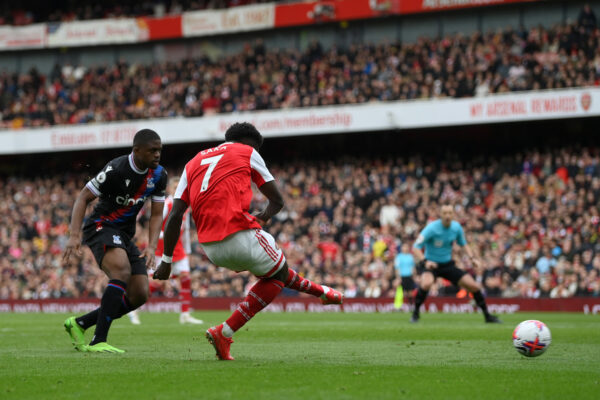 LONDON, ENGLAND - MARCH 19: Bukayo Saka of Arsenal scores the team's second goal during the Premier League match between Arsenal FC and Crystal Palace at Emirates Stadium on March 19, 2023 in London, England. (Photo by Shaun Botterill/Getty Images)