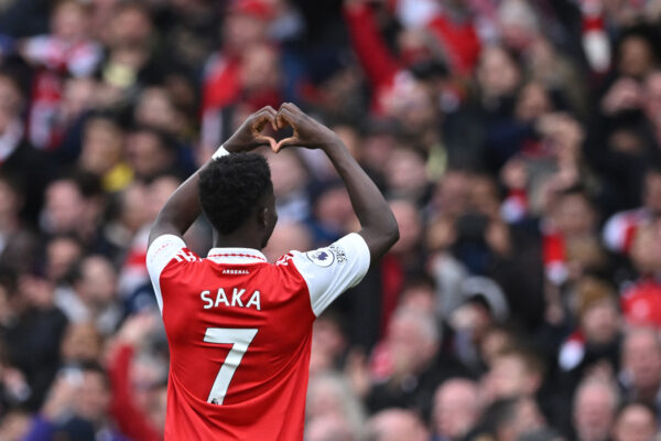 Arsenal's English midfielder Bukayo Saka celebrates after scoring their fourth goal during the English Premier League football match between Arsenal and Crystal Palace at the Emirates Stadium in London on March 19, 2023. (Photo by JUSTIN TALLIS / AFP) / RESTRICTED TO EDITORIAL USE. No use with unauthorized audio, video, data, fixture lists, club/league logos or 'live' services. Online in-match use limited to 120 images. An additional 40 images may be used in extra time. No video emulation. Social media in-match use limited to 120 images. An additional 40 images may be used in extra time. No use in betting publications, games or single club/league/player publications. / (Photo by JUSTIN TALLIS/AFP via Getty Images)