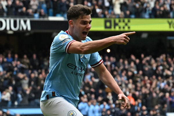 Manchester City's Argentinian striker Julian Alvarez celebrates after scoring their first goal during the English Premier League football match between Manchester City and Liverpool at the Etihad Stadium in Manchester, north west England, on April 1, 2023. (Photo by Paul ELLIS / AFP) / RESTRICTED TO EDITORIAL USE. No use with unauthorized audio, video, data, fixture lists, club/league logos or 'live' services. Online in-match use limited to 120 images. An additional 40 images may be used in extra time. No video emulation. Social media in-match use limited to 120 images. An additional 40 images may be used in extra time. No use in betting publications, games or single club/league/player publications. / (Photo by PAUL ELLIS/AFP via Getty Images)