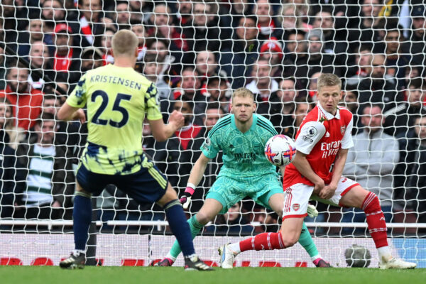 Leeds United's Danish defender Rasmus Kristensen (L) scores their first goal from a deflected shot off Arsenal's Ukrainian defender Oleksandr Zinchenko (R) during the English Premier League football match between Arsenal and Leeds United at the Emirates Stadium in London on April 1, 2023. (Photo by Glyn KIRK / AFP) / RESTRICTED TO EDITORIAL USE. No use with unauthorized audio, video, data, fixture lists, club/league logos or 'live' services. Online in-match use limited to 120 images. An additional 40 images may be used in extra time. No video emulation. Social media in-match use limited to 120 images. An additional 40 images may be used in extra time. No use in betting publications, games or single club/league/player publications. / (Photo by GLYN KIRK/AFP via Getty Images)