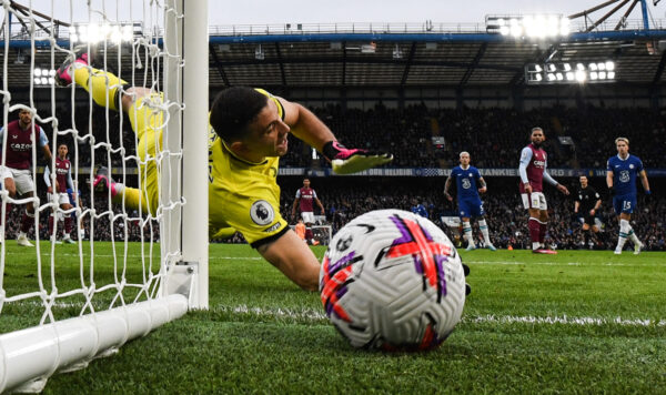 Aston Villa's Argentinian goalkeeper Emiliano Martinez jumps for the ball during the English Premier League football match between Chelsea and Aston Villa at Stamford Bridge in London on April 1, 2023. (Photo by JUSTIN TALLIS / AFP) / RESTRICTED TO EDITORIAL USE. No use with unauthorized audio, video, data, fixture lists, club/league logos or 'live' services. Online in-match use limited to 120 images. An additional 40 images may be used in extra time. No video emulation. Social media in-match use limited to 120 images. An additional 40 images may be used in extra time. No use in betting publications, games or single club/league/player publications. / (Photo by JUSTIN TALLIS/AFP via Getty Images)