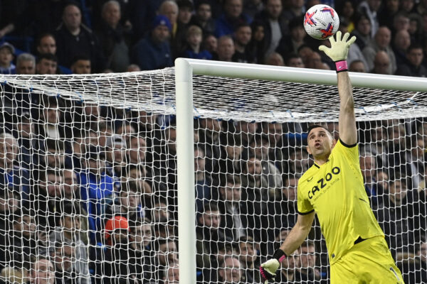 Aston Villa's Argentinian goalkeeper Emiliano Martinez saves a shot during the English Premier League football match between Chelsea and Aston Villa at Stamford Bridge in London on April 1, 2023. (Photo by JUSTIN TALLIS / AFP) / RESTRICTED TO EDITORIAL USE. No use with unauthorized audio, video, data, fixture lists, club/league logos or 'live' services. Online in-match use limited to 120 images. An additional 40 images may be used in extra time. No video emulation. Social media in-match use limited to 120 images. An additional 40 images may be used in extra time. No use in betting publications, games or single club/league/player publications. / (Photo by JUSTIN TALLIS/AFP via Getty Images)