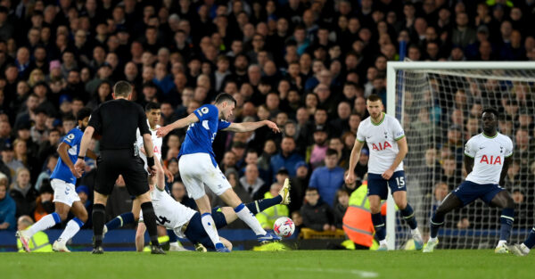 LIVERPOOL, ENGLAND - APRIL 03: Everton player Michael Keane shoots to score the Everton goal during the Premier League match between Everton FC and Tottenham Hotspur at Goodison Park on April 03, 2023 in Liverpool, England. (Photo by Stu Forster/Getty Images)