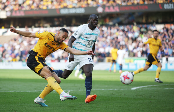 WOLVERHAMPTON, ENGLAND - APRIL 08: Matheus Cunha of Wolverhampton Wanderers shoots past Kalidou Koulibaly of Chelsea during the Premier League match between Wolverhampton Wanderers and Chelsea FC at Molineux on April 08, 2023 in Wolverhampton, England. (Photo by Eddie Keogh/Getty Images)