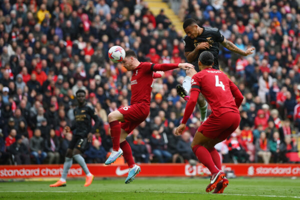 LIVERPOOL, ENGLAND - APRIL 09: Gabriel Jesus of Arsenal scores the team's second goal whilst under pressure from Andrew Robertson of Liverpool during the Premier League match between Liverpool FC and Arsenal FC at Anfield on April 09, 2023 in Liverpool, England. (Photo by Shaun Botterill/Getty Images)