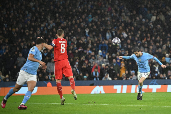 Manchester City's Portuguese midfielder Bernardo Silva (R) heads home their second goal during the UEFA Champions League quarter final, first leg football match between Manchester City and Bayern Munich at the Etihad Stadium in Manchester, north-west England, on April 11, 2023. (Photo by Oli SCARFF / AFP) (Photo by OLI SCARFF/AFP via Getty Images)
