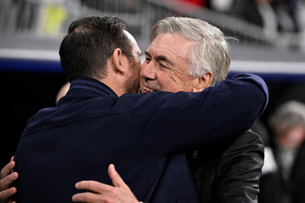 Real Madrid's Italian coach Carlo Ancelotti (R) hugs Chelsea's English coach Frank Lampard prior the UEFA Champions League quarter final first leg football match between Real Madrid CF and Chelsea FC at the Santiago Bernabeu stadium in Madrid on April 12, 2023. (Photo by JAVIER SORIANO / AFP) 