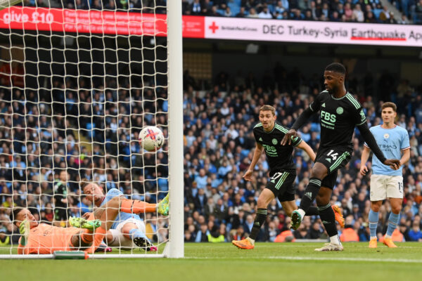 MANCHESTER, ENGLAND - APRIL 15: Kelechi Iheanacho of Leicester City scores the team's first goal during the Premier League match between Manchester City and Leicester City at Etihad Stadium on April 15, 2023 in Manchester, England. 