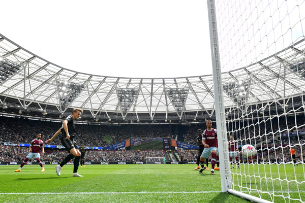 LONDON, ENGLAND - APRIL 16: Martin Odegaard of Arsenal scores the team's second goal during the Premier League match between West Ham United and Arsenal FC at London Stadium on April 16, 2023 in London, England. 