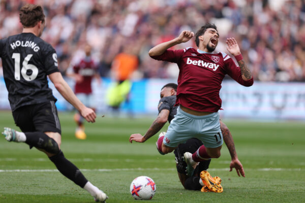 LONDON, ENGLAND - APRIL 16: Lucas Paqueta of West Ham United is fouled by Gabriel of Arsenal leading to a penalty during the Premier League match between West Ham United and Arsenal FC at London Stadium on April 16, 2023 in London, England. 