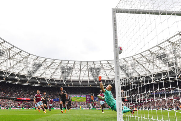 LONDON, ENGLAND - APRIL 16: Jarrod Bowen of West Ham United scores the team's second goal past Aaron Ramsdale of Arsenal during the Premier League match between West Ham United and Arsenal FC at London Stadium on April 16, 2023 in London, England. 