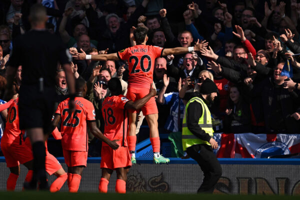 Brighton's Paraguayan striker Julio Enciso (C) celebrates with teammates in front of fans after scoring their second goal during the English Premier League football match between Chelsea and Brighton and Hove Albion at Stamford Bridge in London on April 15, 2023. (Photo by Ben Stansall / AFP) / RESTRICTED TO EDITORIAL USE. No use with unauthorized audio, video, data, fixture lists, club/league logos or 'live' services. Online in-match use limited to 120 images. An additional 40 images may be used in extra time. No video emulation. Social media in-match use limited to 120 images. An additional 40 images may be used in extra time. No use in betting publications, games or single club/league/player publications. / 