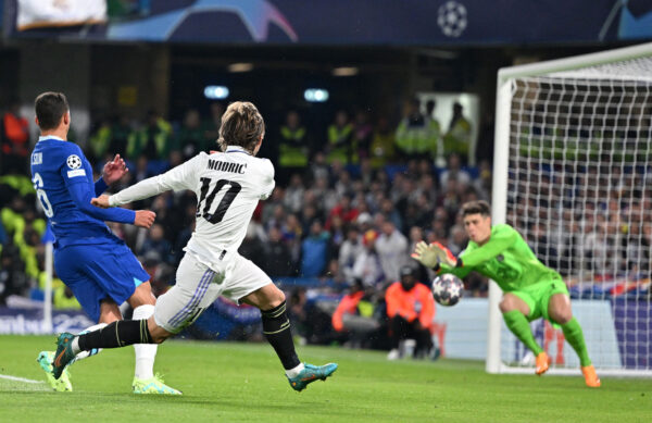 Real Madrid's Croatian midfielder Luka Modric shoots but fails to score during the Champions League quarter-final second-leg football match between Chelsea and Real Madrid at Stamford Bridge in London on April 18, 2023. (Photo by Glyn KIRK / AFP) 