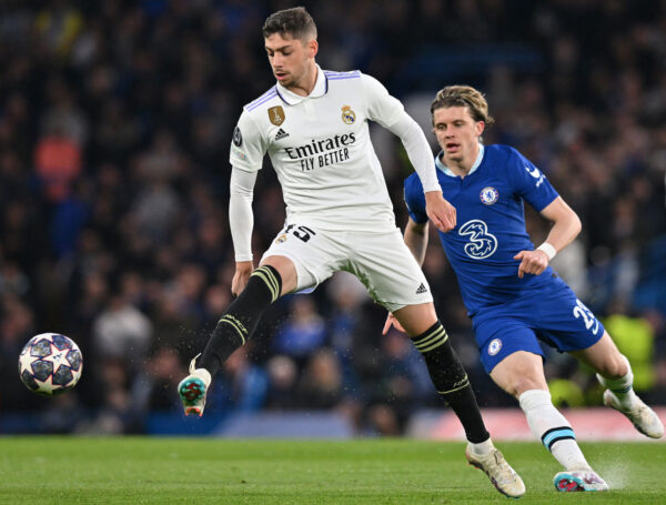 Chelsea's English midfielder Conor Gallagher (R) vies with Real Madrid's Uruguayan midfielder Federico Valverde during the Champions League quarter-final second-leg football match between Chelsea and Real Madrid at Stamford Bridge in London on April 18, 2023. (Photo by Glyn KIRK / AFP) 