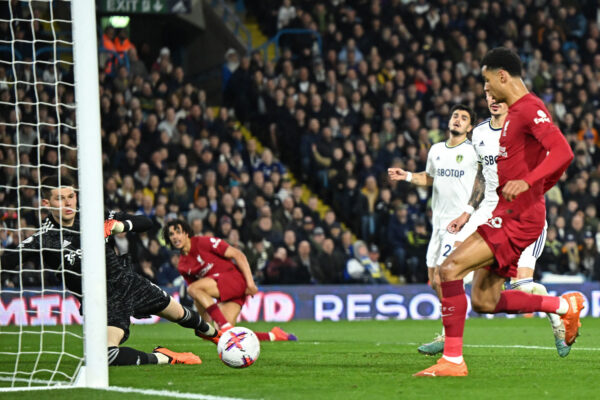 Liverpool's Dutch striker Cody Gakpo (R) scores the opening goal from close-range during the English Premier League football match between Leeds United and Liverpool at Elland Road in Leeds, northern England on April 17, 2023. (Photo by Oli SCARFF / AFP) / RESTRICTED TO EDITORIAL USE. No use with unauthorized audio, video, data, fixture lists, club/league logos or 'live' services. Online in-match use limited to 120 images. An additional 40 images may be used in extra time. No video emulation. Social media in-match use limited to 120 images. An additional 40 images may be used in extra time. No use in betting publications, games or single club/league/player publications. / 