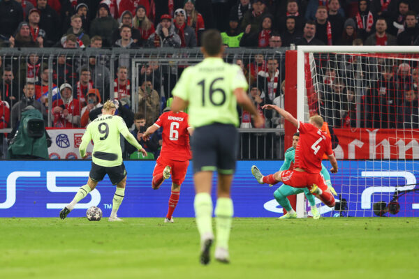 MUNICH, GERMANY - APRIL 19: Erling Haaland of Manchester City scores the team's first goal during the UEFA Champions League quarterfinal second leg match between FC Bayern M眉nchen and Manchester City at Allianz Arena on April 19, 2023 in Munich, Germany. 