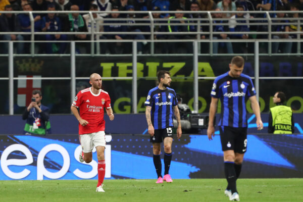 MILAN, ITALY - APRIL 19: Fredrik Aursnes of SL Benfica celebrates after scoring the team's first goal as Francesco Acerbi of FC Internazionale looks dejected during the UEFA Champions League quarterfinal second leg match between FC Internazionale and SL Benfica at San Siro Stadium on April 19, 2023 in Milan, Italy. 
