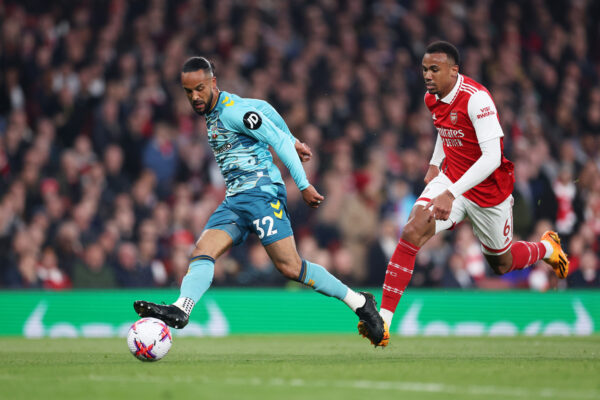LONDON, ENGLAND - APRIL 21: Theo Walcott of Southampton scores the team's second goal past Gabriel of Arsenal during the Premier League match between Arsenal FC and Southampton FC at Emirates Stadium on April 21, 2023 in London, England. 